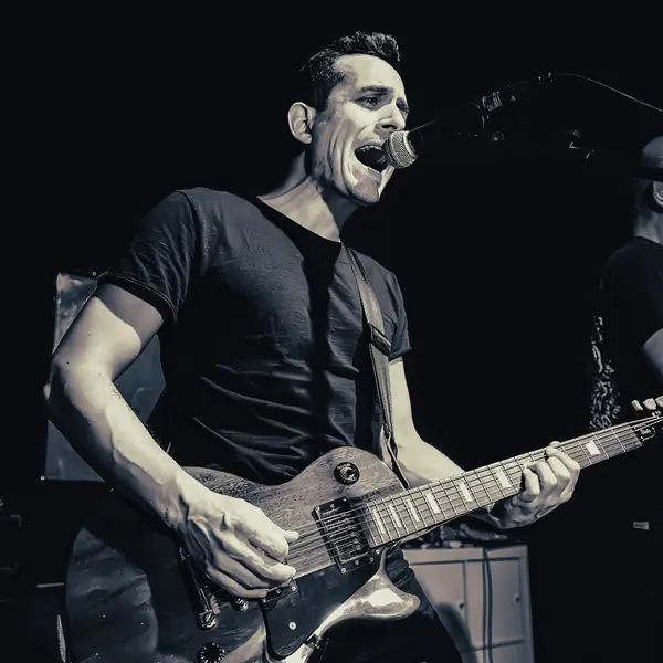 Maurizio Murciato singing and playing guitar